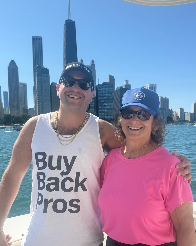 Sam Herwitz wearing a Buy Back Pros shirt in front of the Chicago skyline